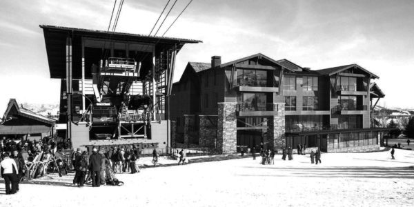 Mountain hospitality lodge interior with custom wood millwork and stone fireplace